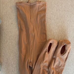 One piece strapless bodysuit with clear straps.